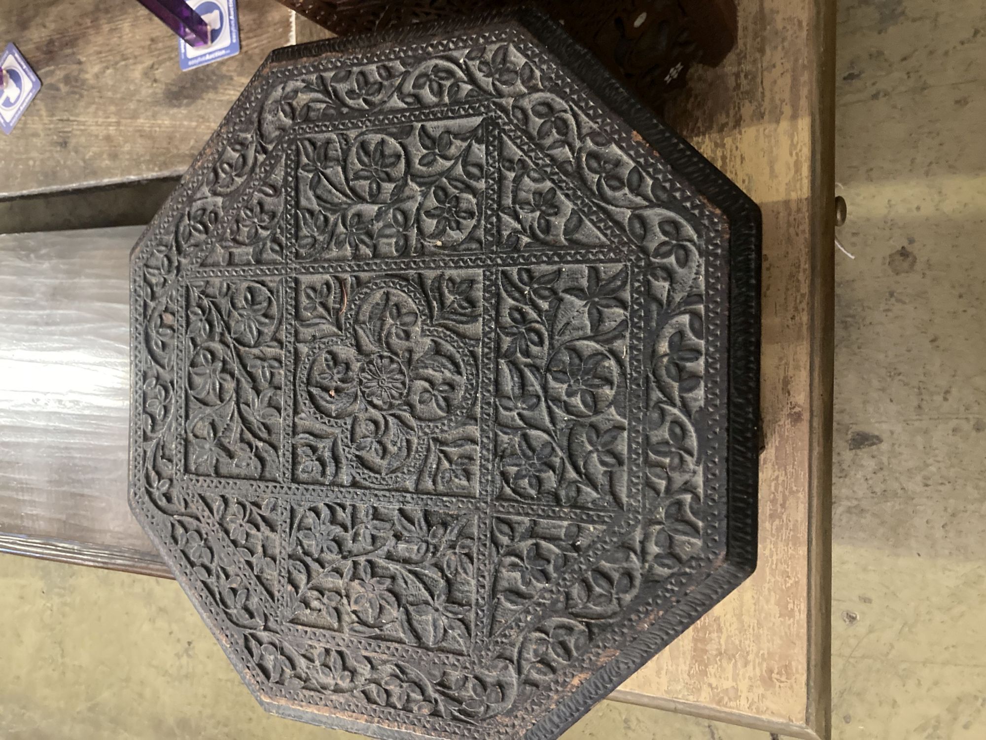 Two Moorish octagonal carved occasional tables, larger width 38cm, height 42cm